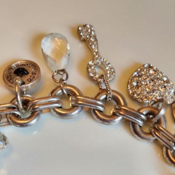 FOSSIL SILVER AND CRYSTAL CHARM BRACELET WITH TOGGLE CLOSURE - Picture 2 of 3